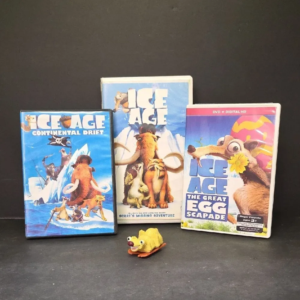 collection of Ice Age merchandise, including a VHS tape, two DVDs, Sid the Sloth